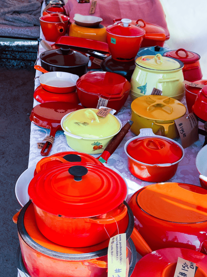 Vintage bright red, orange and yellow cast iron enamelware. 