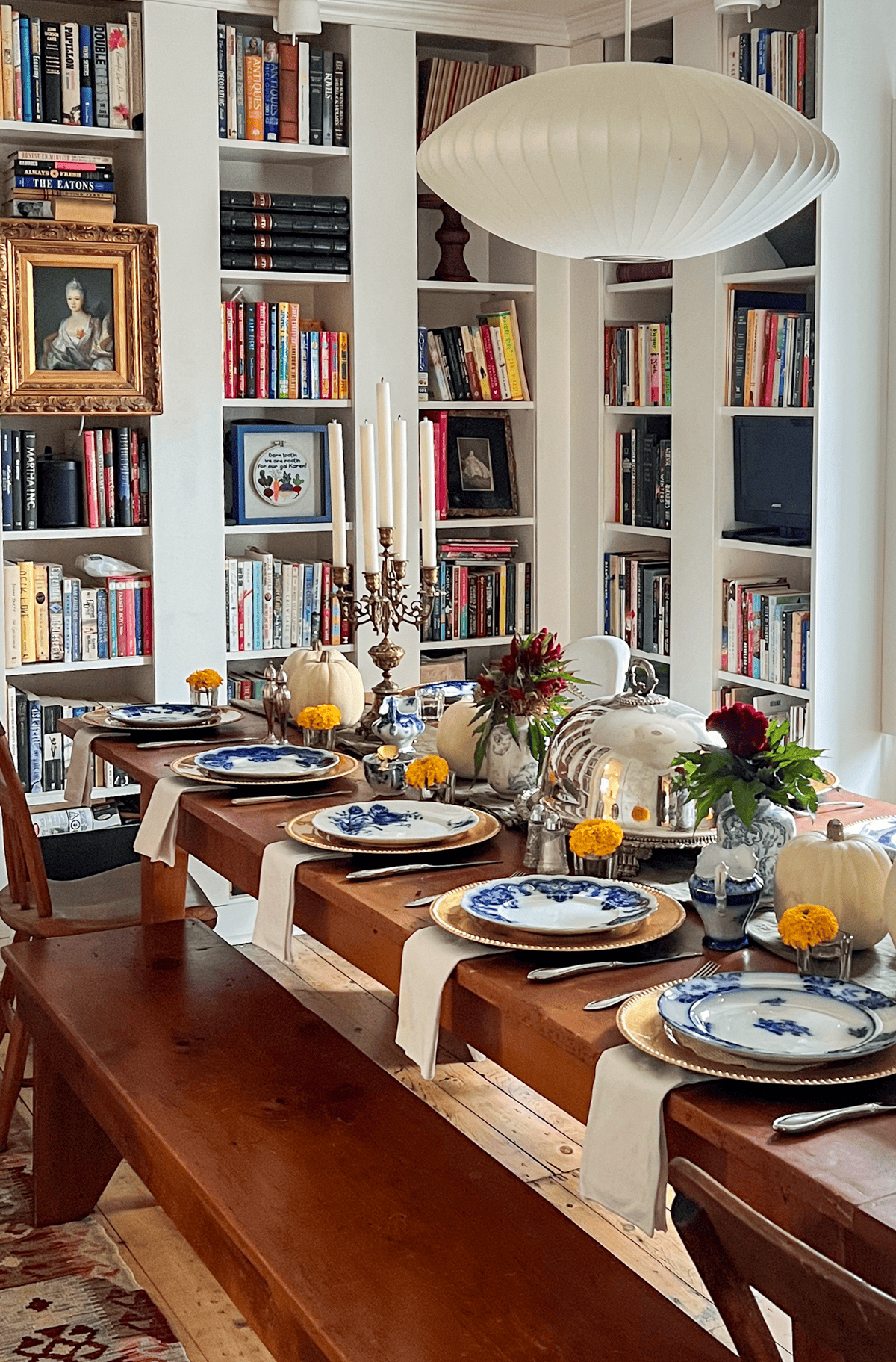 Thanksgiving dinner casual elegant place settings with flow blue and marigolds.