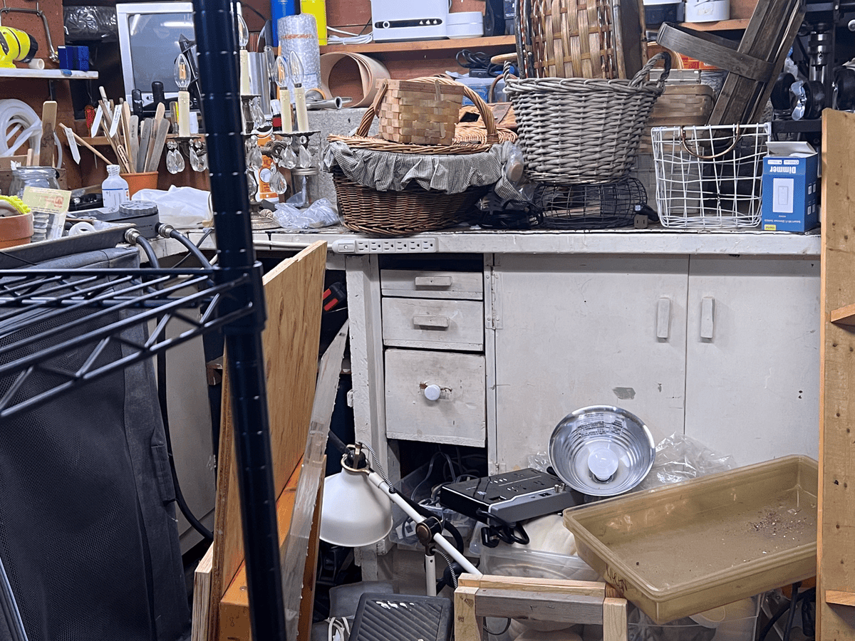 Very messy, cluttered basement.