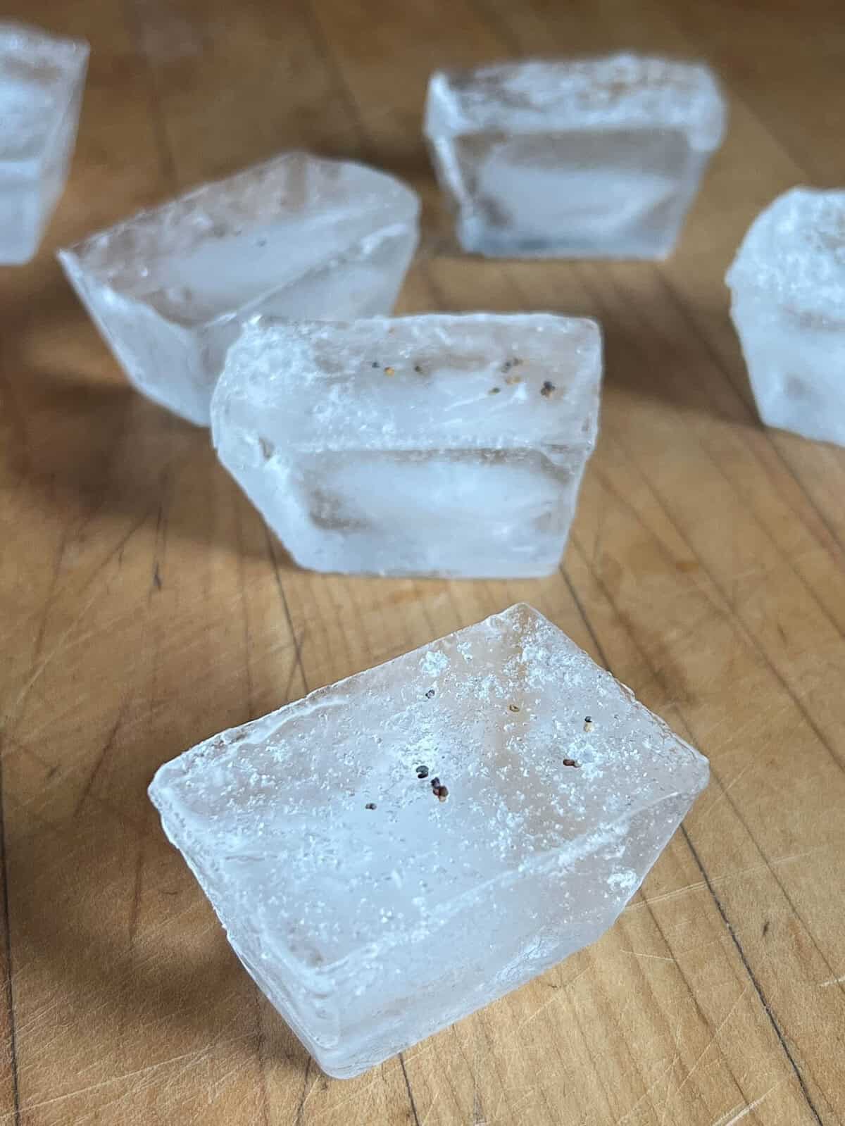 Poppy seeds in ice cubes.