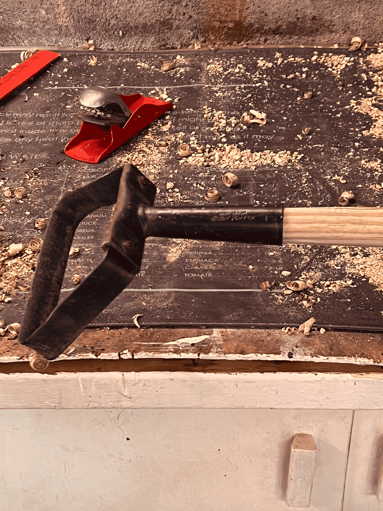 A stirrup hoe being fit for a new hand planed handle.