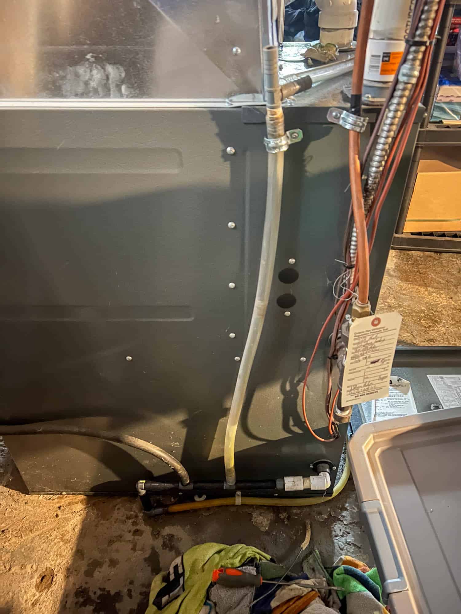 Reconnected drain lines and connectors on HVAC unit after unclogging drain line.