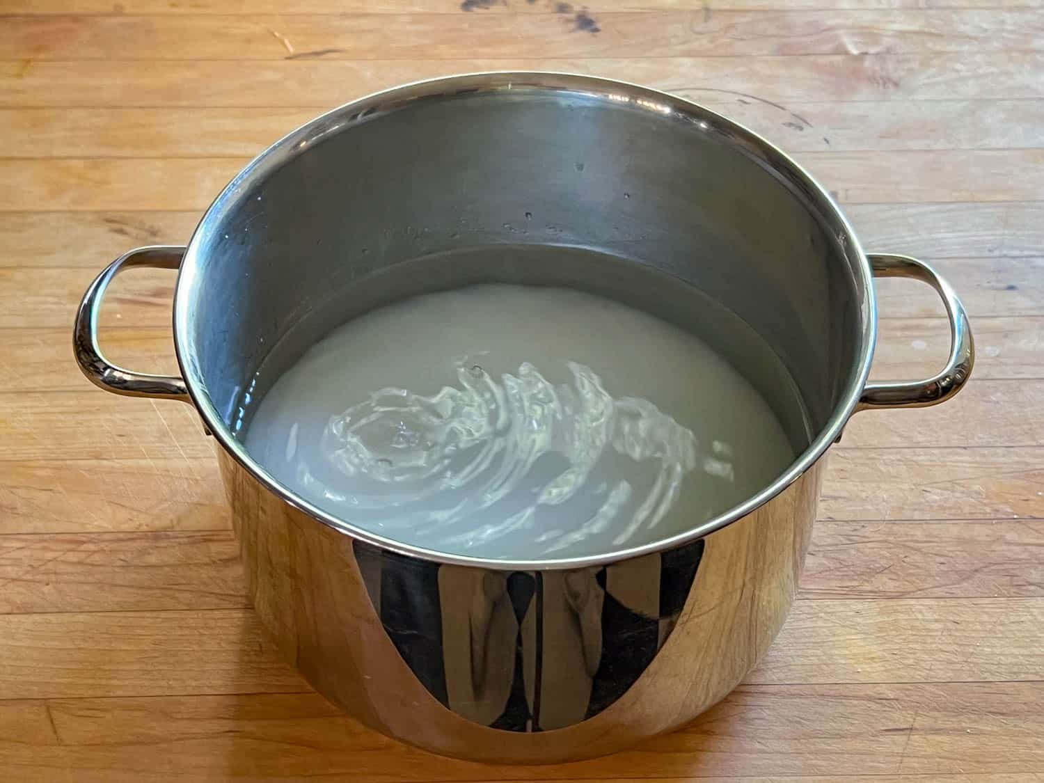 A large pot with sugar and water for a simple syrup.