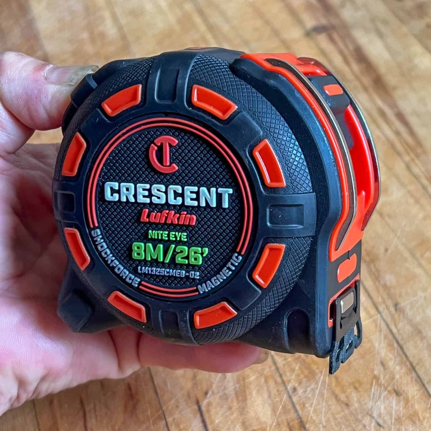 New Lufkin measuring tape with black and red plastic casing.
