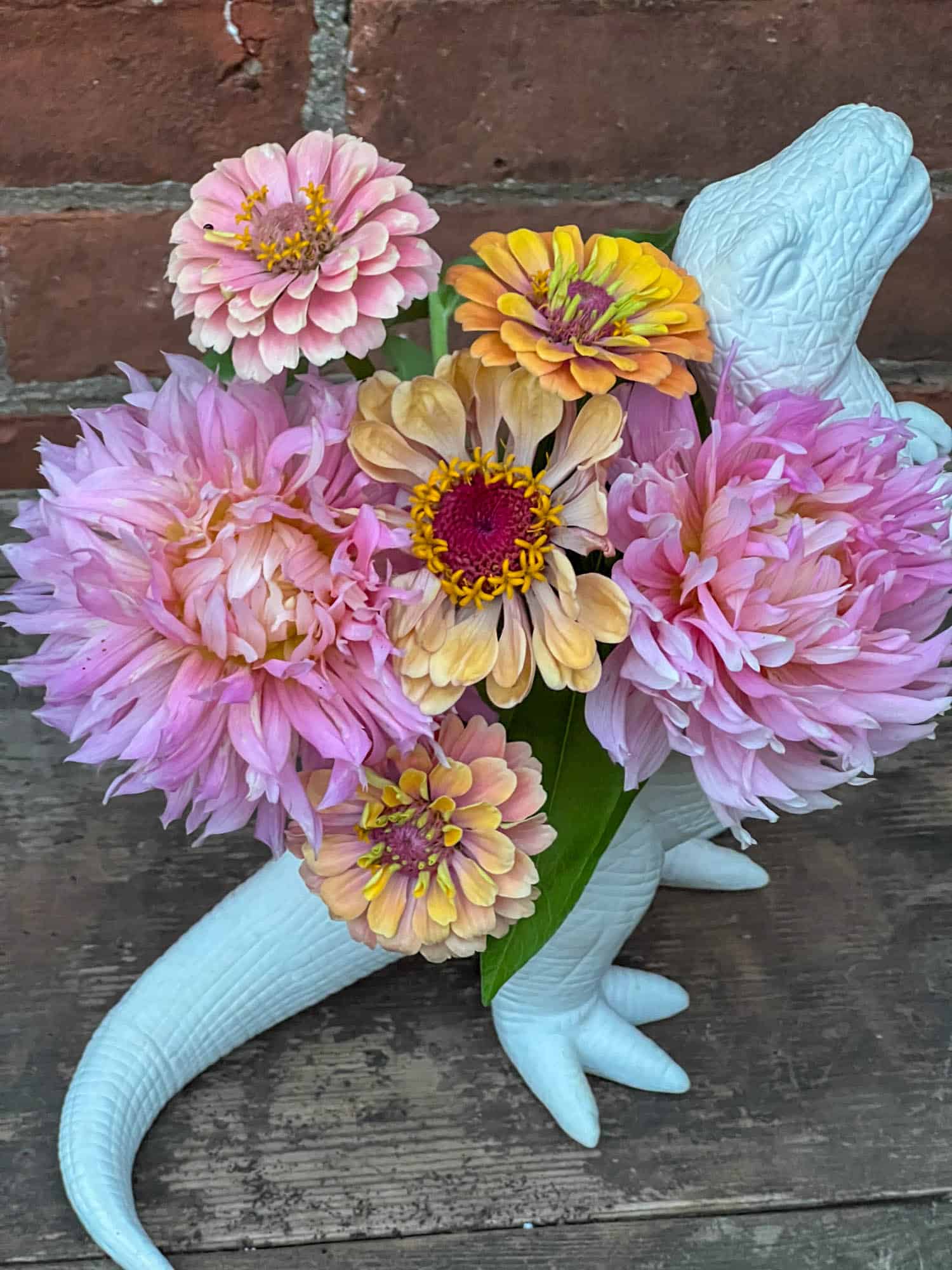 Miss Tegan dahlias with Floret Original zinnias in a Kikkerland plantosauraus vase.
