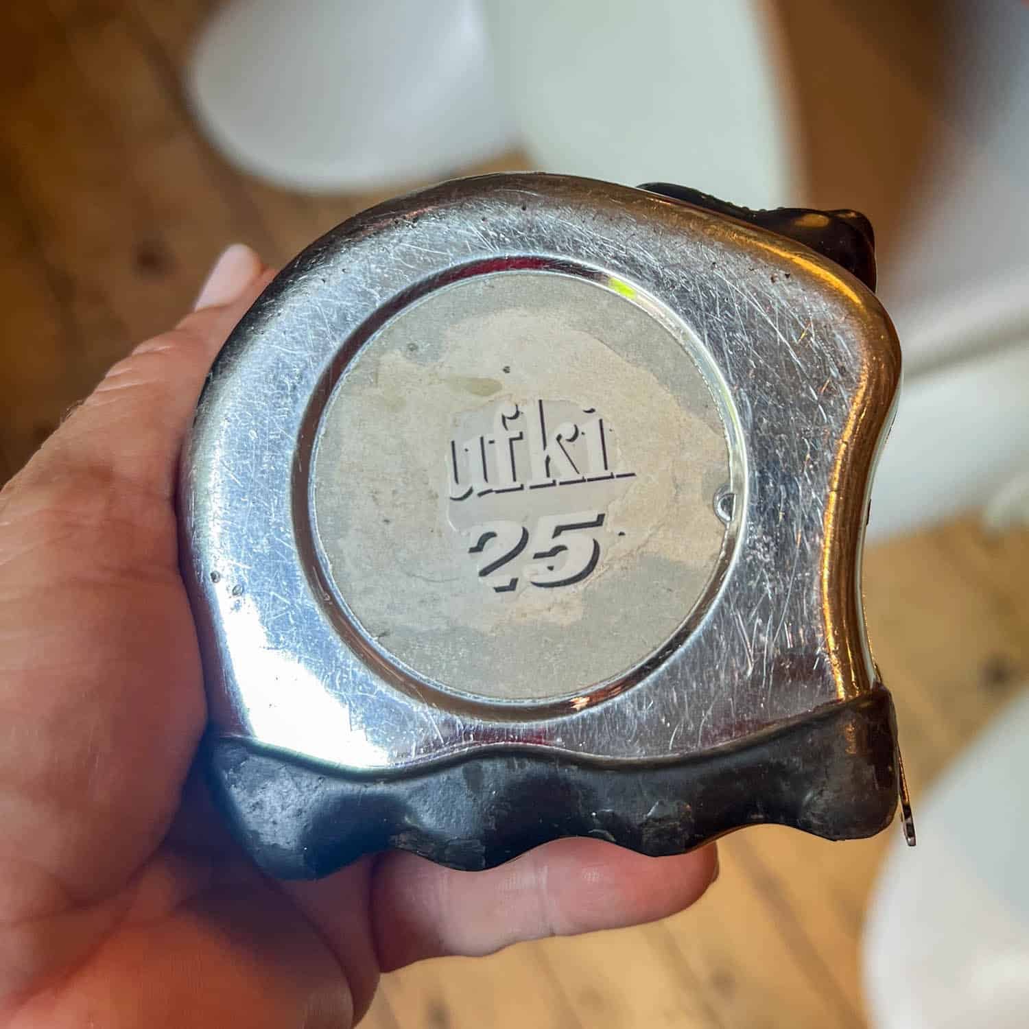 Very worn, 10 year old Lufkin measuring tape at its end of life.