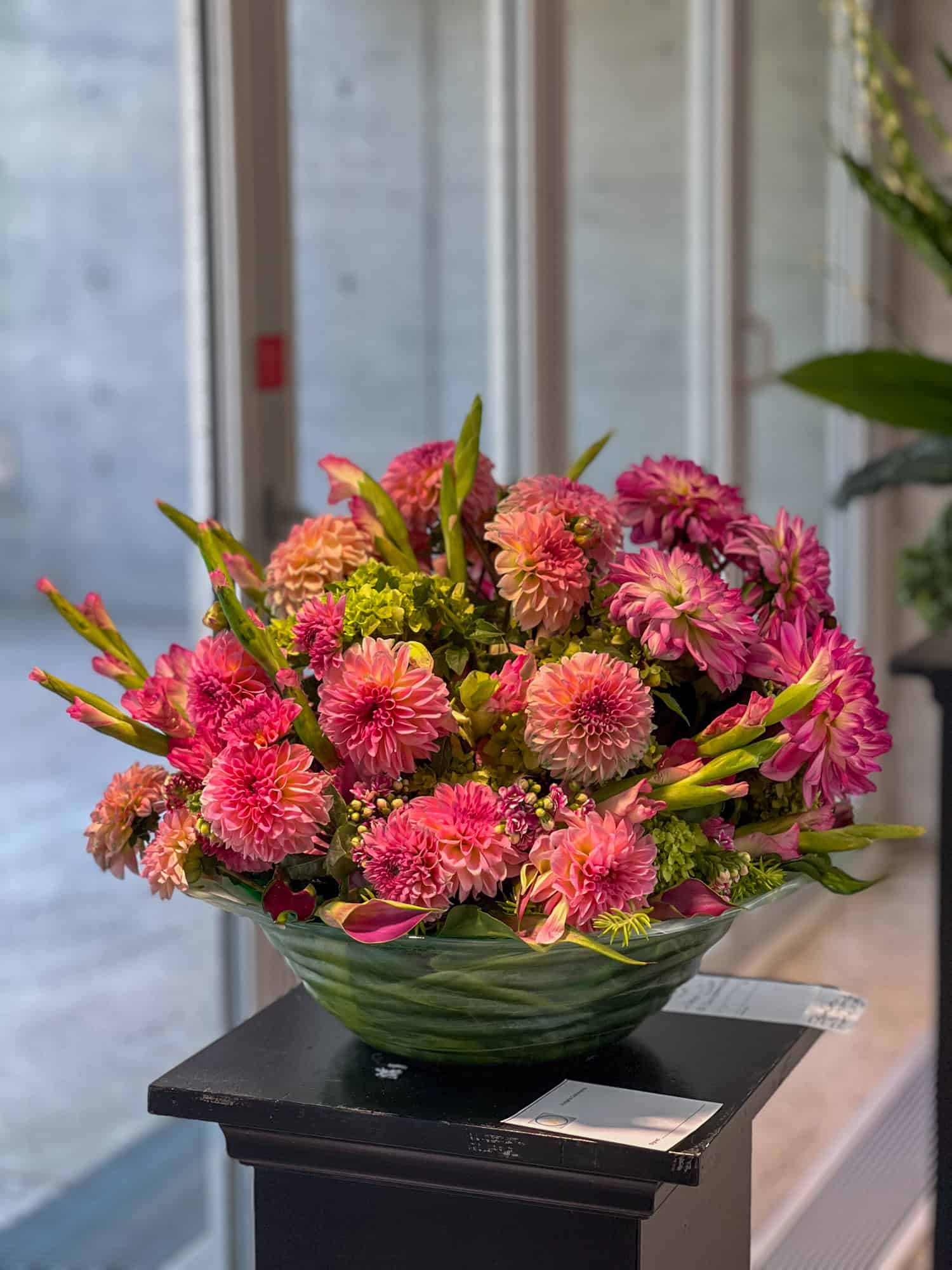 Colourful flower arrangement of pinks and greens.